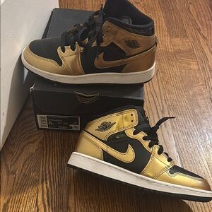Worn 2x Air Jordan Black and Gold Sneakers size 6 kids.